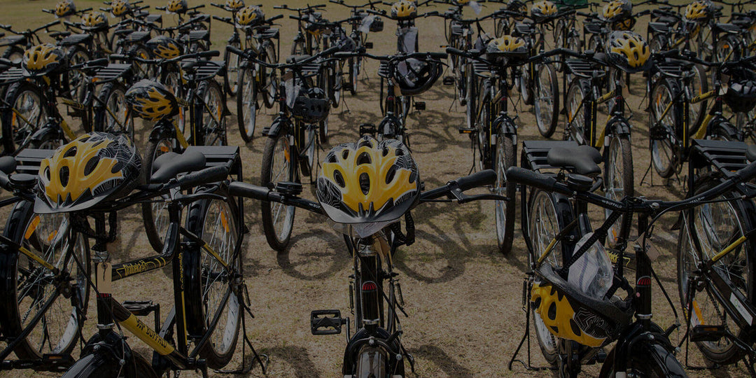 Champions Delivering Bikes: <br> Team Dimension Data Hands Over 175 Qhubeka Bikes to School Kids