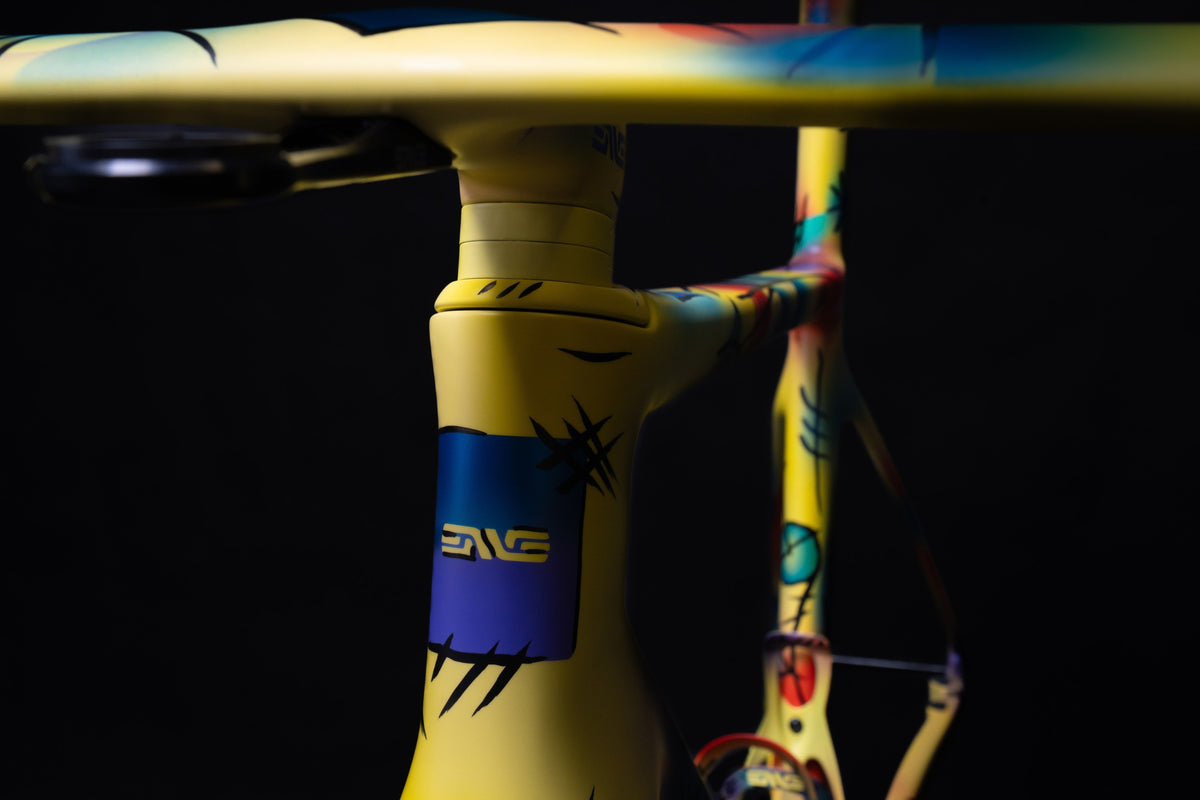 Close-up of a yellow ENVE Custom Road with expressive multicolor artwork